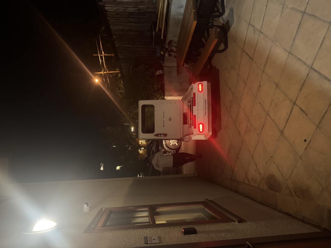 The truck at night with its taillights glowing red